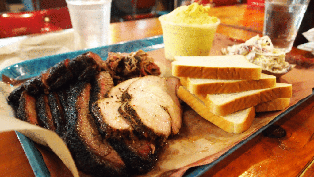 Restaurant Review of waiting in line for hours to get the best BBQ in Texas at Franklin's BBQ in Austin, Texas. Get there by 9 am to snag a place in line and be prepared to wait in the heat. Bring a lawn chair and some water while you wait. 